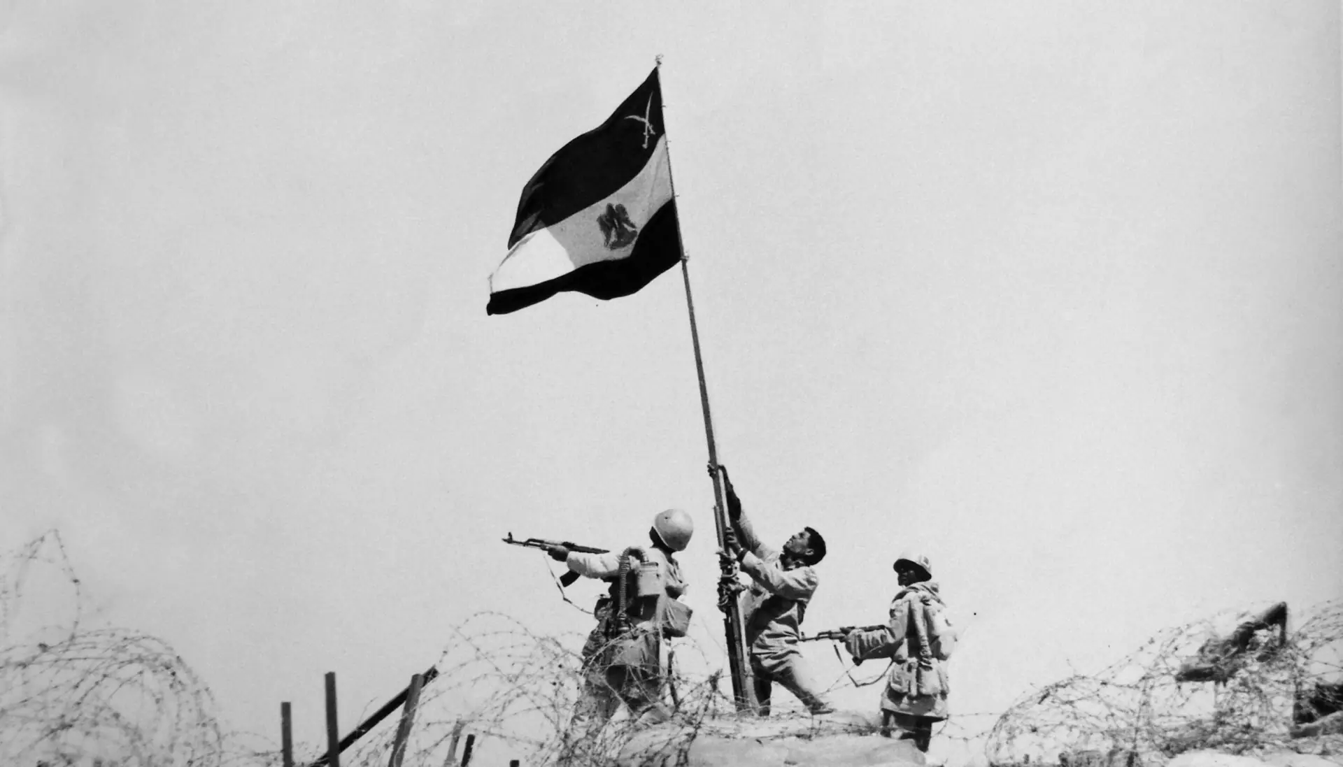 Egyptian soldiers raising the national flag during the October War of 1973, a defining moment in modern Egyptian military history.